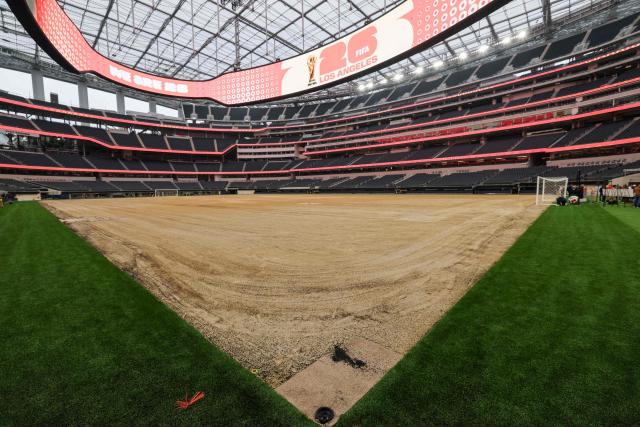 An expanded pitch surface area, which required the removal of corner seating and a raised custom field platform, awaits the installation of grass during the 30 Days to FIFA World Cup 2026 media event at SoFI Stadium before the pitch installation and temporary renaming to Los Angeles Stadium in Inglewood, California on May 12, 2026. The US Men's National Team will play their first 2026 FIFA World Cup match on June 12 against Paraguay. (Photo by Patrick T. Fallon / AFP)