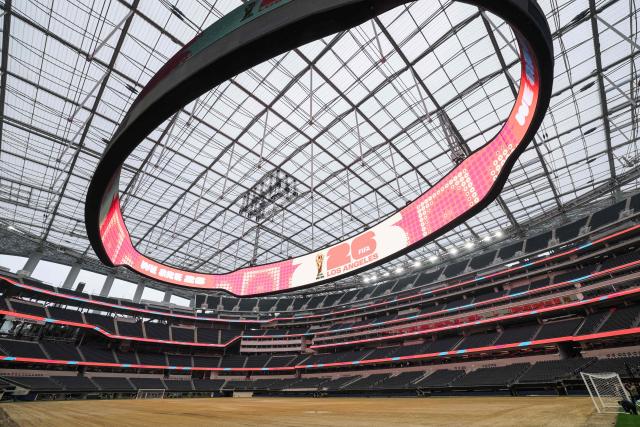 An expanded pitch surface area, which required the removal of corner seating and a raised custom field platform, awaits the installation of grass during the 30 Days to FIFA World Cup 2026 media event at SoFI Stadium before the pitch installation and temporary renaming to Los Angeles Stadium in Inglewood, California on May 12, 2026. The US Men's National Team will play their first 2026 FIFA World Cup match on June 12 against Paraguay. (Photo by Patrick T. Fallon / AFP)