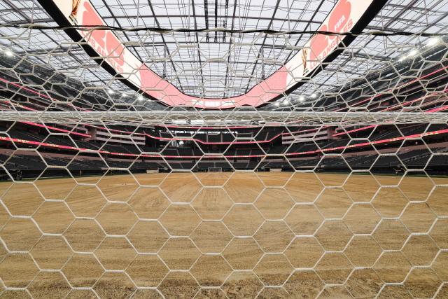 An expanded pitch surface area, which required the removal of corner seating and a raised custom field platform, awaits the installation of grass during the 30 Days to FIFA World Cup 2026 media event at SoFI Stadium before the pitch installation and temporary renaming to Los Angeles Stadium in Inglewood, California on May 12, 2026. The US Men's National Team will play their first 2026 FIFA World Cup match on June 12 against Paraguay. (Photo by Patrick T. Fallon / AFP)