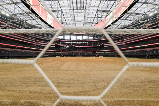 An expanded pitch surface area, which required the removal of corner seating and a raised custom field platform, awaits the installation of grass during the 30 Days to FIFA World Cup 2026 media event at SoFI Stadium before the pitch installation and temporary renaming to Los Angeles Stadium in Inglewood, California on May 12, 2026. The US Men's National Team will play their first 2026 FIFA World Cup match on June 12 against Paraguay. (Photo by Patrick T. Fallon / AFP)