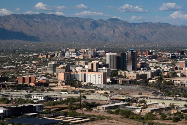 A view of Tucson is seen from Sentinel Peak in Tucson, Arizona, on May 7, 2026. In the Strait of Hormuz, US warships menace Iran's oil tankers. In Washington, President Donald Trump threatens nothing less than "complete victory" will suffice. But in Tucson, they're getting ready to welcome the Iranian football team as if nothing were amiss. The city, an oasis of manicured lawns in the Arizona desert, is set to be the base camp for "Team Melli" when the world's biggest sporting spectacle opens in the US, Mexico and Canada next month. (Photo by Rebecca NOBLE / AFP)