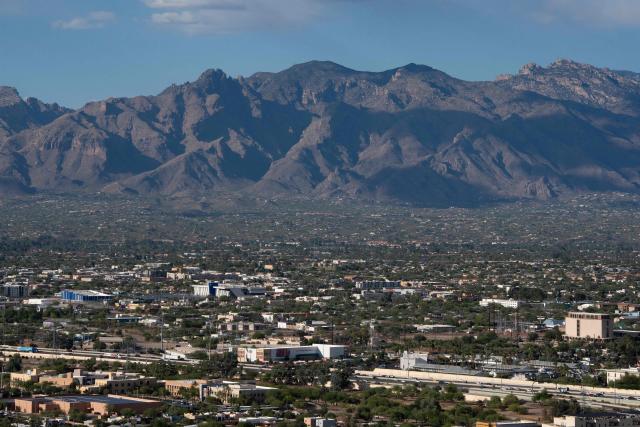 A view of Tucson is seen from Sentinel Peak in Tucson, Arizona, on May 7, 2026. In the Strait of Hormuz, US warships menace Iran's oil tankers. In Washington, President Donald Trump threatens nothing less than "complete victory" will suffice. But in Tucson, they're getting ready to welcome the Iranian football team as if nothing were amiss. The city, an oasis of manicured lawns in the Arizona desert, is set to be the base camp for "Team Melli" when the world's biggest sporting spectacle opens in the US, Mexico and Canada next month. (Photo by Rebecca NOBLE / AFP)