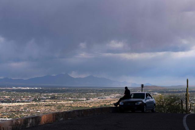 A view of Tucson is seen from Sentinel Peak in Tucson, Arizona, on May 7, 2026. In the Strait of Hormuz, US warships menace Iran's oil tankers. In Washington, President Donald Trump threatens nothing less than "complete victory" will suffice. But in Tucson, they're getting ready to welcome the Iranian football team as if nothing were amiss. The city, an oasis of manicured lawns in the Arizona desert, is set to be the base camp for "Team Melli" when the world's biggest sporting spectacle opens in the US, Mexico and Canada next month. (Photo by Rebecca NOBLE / AFP)
