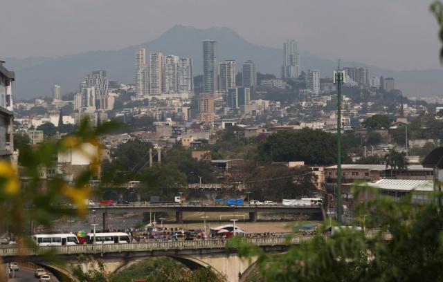Haze covers the city during a heatwave in Tegucigalpa City on May 12, 2026. Honduras has decided to shorten the school-day and hold virtual classes due to the high temperatures that could intensify due to El Nino phenomenon, official sources reported. (Photo by Johny MAGALLANES / AFP)
