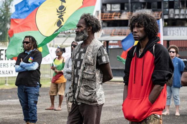 Pro-independence activists and supporters take part in a demonstration to mark the second anniversary of the spring 2024 riots in Noumea, in the French overseas collectivity of New Caledonia, on May 13, 2026. Two years after the violence that left 14 dead and caused several billion euros’ worth of damage in New Caledonia, tensions and mistrust remain, as the debate over the electoral roll, which sparked the insurrectional crisis, is still unresolved. (Photo by Delphine MAYEUR / AFP)