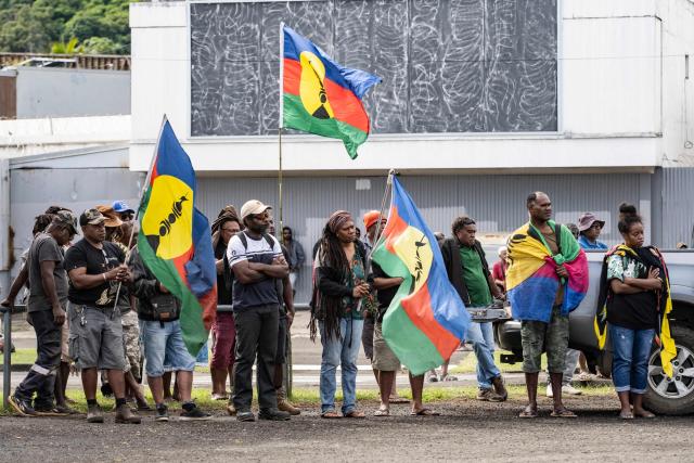 Pro-independence activists and supporters take part in a demonstration to mark the second anniversary of the spring 2024 riots in Noumea, in the French overseas collectivity of New Caledonia, on May 13, 2026. Two years after the violence that left 14 dead and caused several billion euros’ worth of damage in New Caledonia, tensions and mistrust remain, as the debate over the electoral roll, which sparked the insurrectional crisis, is still unresolved. (Photo by Delphine MAYEUR / AFP)