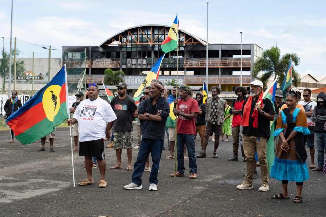 Pro-independence activists and supporters take part in a demonstration to mark the second anniversary of the spring 2024 riots in Noumea, in the French overseas collectivity of New Caledonia, on May 13, 2026. Two years after the violence that left 14 dead and caused several billion euros’ worth of damage in New Caledonia, tensions and mistrust remain, as the debate over the electoral roll, which sparked the insurrectional crisis, is still unresolved. (Photo by Delphine MAYEUR / AFP)