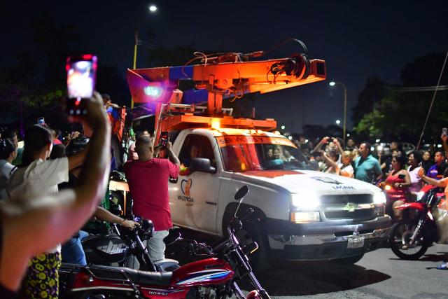 Residents of City Plaza neighborhood protest the lack of electricity and water in Valencia, Venezuela on May 12, 2026. (Photo by Jacinto Oliveros str / AFP)
