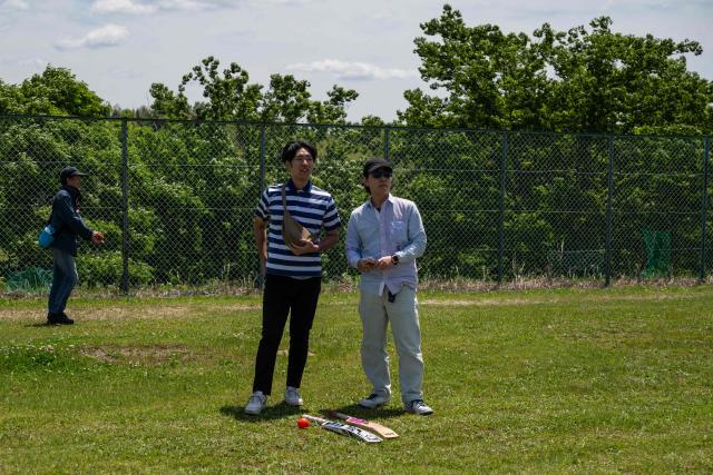 In this photo taken on May 9, 2026, spectators watch the ICC T20 World Cup East Asia-Pacific Qualifier match between Japan and Vanuatu at the Nisshin Cricket Ground at Korogi Sports Park in Nisshin, Aichi Prefecture. Curious spectators clutching rulebooks watch as a batsman smacks a six into the sand and weeds surrounding Japan's brand-new cricket ground, four months before it hosts matches at the Asian Games. (Photo by Andrew CABALLERO-REYNOLDS / AFP) / To go with 'ASIAD-2026-CRICKET-JPN,FOCUS' by Andrew MCKIRDY