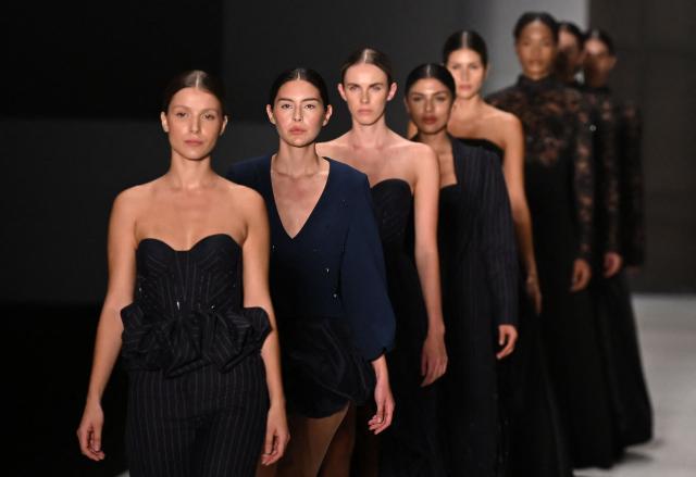 Models present creations by Lorant & Co collection  at Puente catwalk during Bogota Fashion Week, on May 12, 2026. (Photo by Raul ARBOLEDA / AFP)