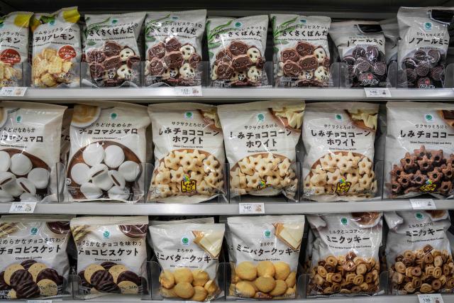 Bags of snacks are on display at a FamilyMart convenience store in Tokyo on May 13, 2026. (Photo by Yuichi YAMAZAKI / AFP)