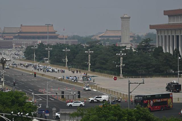 People visit Tiananmen Square in Beijing on May 13, 2026, ahead of a visit by US President Donald Trump. (Photo by Pedro PARDO / AFP)