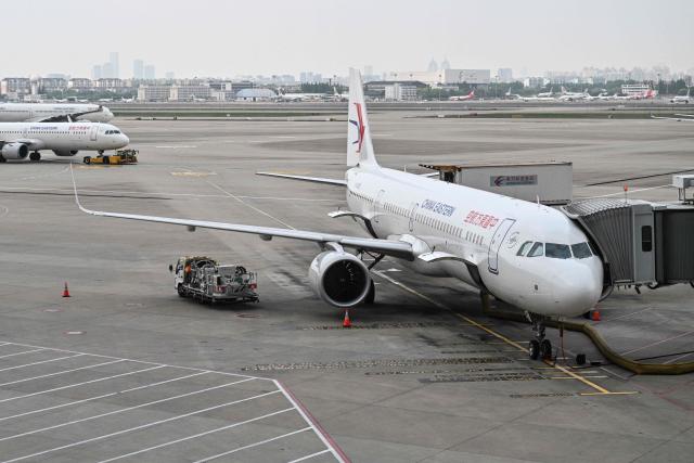 An Airbus A321neo aircraft of China Eastern Airlines is pictured at the Shanghai Hongqiao International Airport in Shanghai on May 12, 2026. (Photo by Hector RETAMAL / AFP)