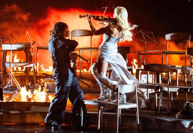 Finnish singers Linda Lampenius and Pete Parkkonen, representing Finland with the song 'Liekinheitin', perform during the first semi-final of the Eurovision Song Contest 2026 (ESC) at Wiener Stadthalle in Vienna, Austria on May 12, 2026. (Photo by GEORG HOCHMUTH / APA / AFP) / Austria OUT