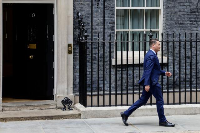 Britain's Health Secretary Wes Streeting leaves Number 10 Downing Street after meeting with the prime minister in central London on May 13, 2026. Britain's Prime Minister Keir Starmer, fighting to face down a revolt within his ruling Labour party, has promised his government will be "better" and bolder to assuage disgruntled voters impatient for change. (Photo by Brook Mitchell / AFP)