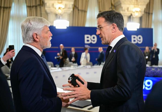 Czech Republic's President Petr Pavel and NATO Secretary General Mark Rutte talk at the start of the plenary the summit of the Bucharest Nine (B9) and the Nordic countries at the Cotroceni Palace in Bucharest, Romania on May 13, 2026. The event is co-chaired by the President of Romania and the President of Poland under the overarching theme of 'Delivering More for Transatlantic Security' and will focus on transatlantic security and NATOs forthcoming summit in Ankara. The B9 format, also known as NATO's Eastern Flank, includes Bulgaria, the Czech Republic, Estonia, Hungary, Latvia, Lithuania, Poland, Romania and Slovakia. (Photo by Daniel MIHAILESCU / AFP)