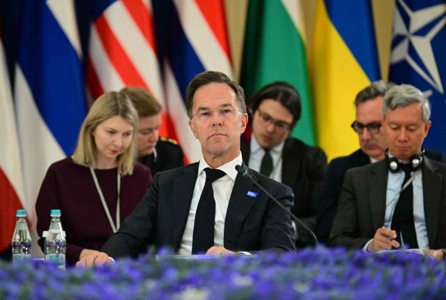 NATO Secretary General Mark Rutte (C) looks on at the start of the plenary the summit of the Bucharest Nine (B9) and the Nordic countries at the Cotroceni Palace in Bucharest, Romania on May 13, 2026. The event is co-chaired by the President of Romania and the President of Poland under the overarching theme of 'Delivering More for Transatlantic Security' and will focus on transatlantic security and NATOs forthcoming summit in Ankara. The B9 format, also known as NATO's Eastern Flank, includes Bulgaria, the Czech Republic, Estonia, Hungary, Latvia, Lithuania, Poland, Romania and Slovakia. (Photo by Daniel MIHAILESCU / AFP)
