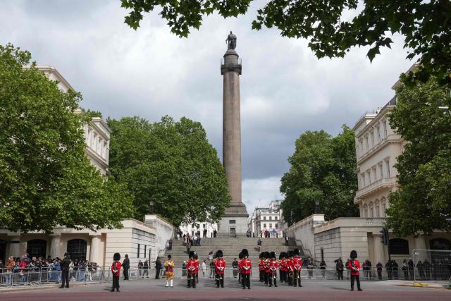 Members of the Welsh Guard, stand on the Mall waiting for Britain's King Charles III to pass  during the State Opening of Parliament, in London on May 13, 2026. (Photo by CARLOS JASSO / AFP)