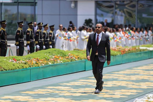 Ethiopia's Prime Minister Abiy Ahmed arrives to welcome France's President Emmanuel Macron at the Bole International Airport in Addis Ababa on May 13, 2026. (Photo by Ludovic MARIN / AFP)
