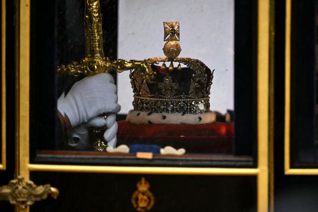 Queen Alexandra's State Coach, carrying the Imperial State Crown and the Sword of State arrives at the Houses of Parliament in London on May 13, 2026, for the State Opening of Parliament.  (Photo by JUSTIN TALLIS / POOL / AFP)