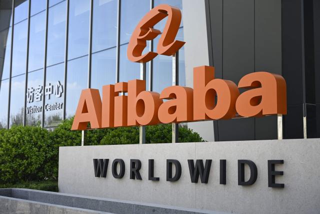 (FILES) The company logo is pictured during a tour at the Alibaba office in Beijing on April 1, 2026. Chinese tech behemoth Alibaba posted an 18 percent drop in net profit during its most recent fiscal year on May 13, 2026, weighed by challenges in the domestic economy and an expensive push into artificial intelligence. (Photo by WANG Zhao / AFP)