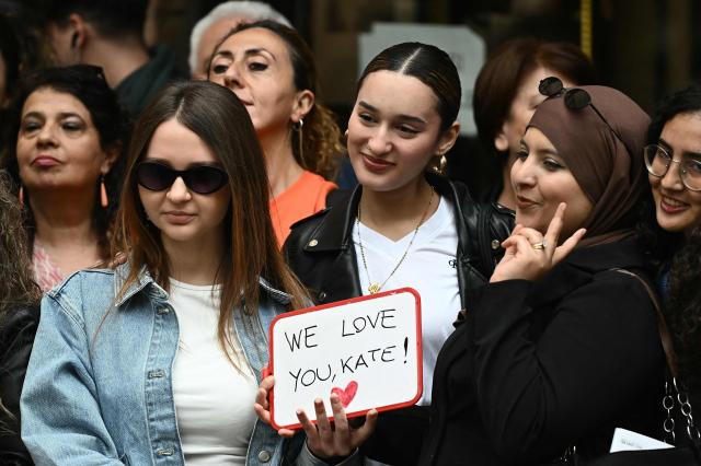 People wait for the arrival of Britain's Catherine, Princess of Wales in front of Reggio Emilia  Town Hall, as part of a two-day trip in Italy, on May 13, 2026. (Photo by Marco BERTORELLO / POOL / AFP)
