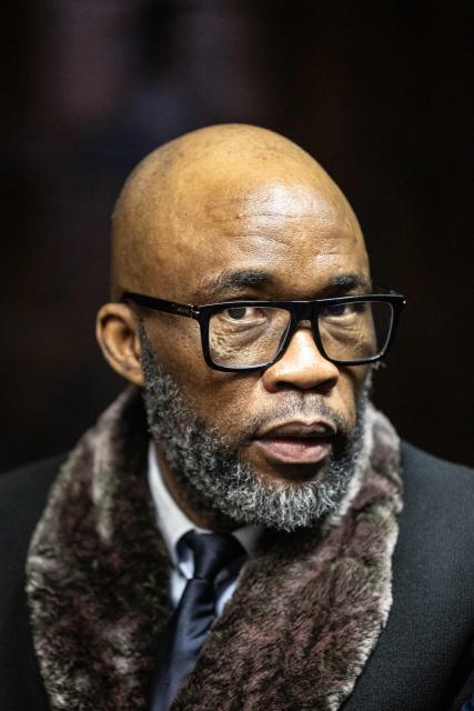 Vusimuzi “Cat” Matlala, suspected of links to organised crime, reacts as he appears for charges linked to an irregular Medicare24 police tender, at the Pretoria Magistrate’s Court in Pretoria on May 13, 2026. (Photo by EMMANUEL CROSET / AFP)