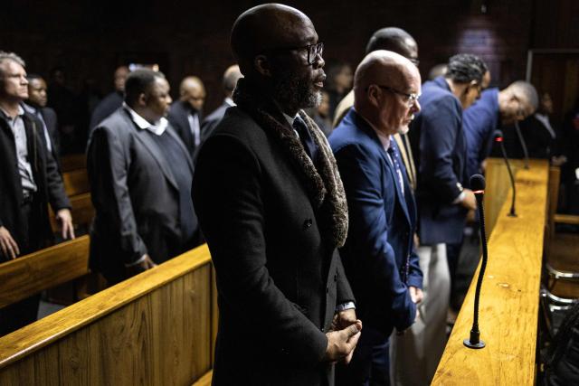 Vusimuzi “Cat” Matlala (C), suspected of links to organised crime, stands in the dock as he appears for charges linked to an irregular Medicare24 police tender, at the Pretoria Magistrate’s Court in Pretoria on May 13, 2026. (Photo by EMMANUEL CROSET / AFP)