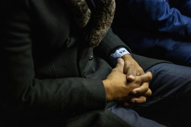 A detailed view of the initials "V.M." embroidered on the shirt cuff of Vusimuzi “Cat” Matlala, suspected of links to organised crime, as he appears for charges linked to an irregular Medicare24 police tender, at the Pretoria Magistrate’s Court in Pretoria on May 13, 2026. (Photo by EMMANUEL CROSET / AFP)