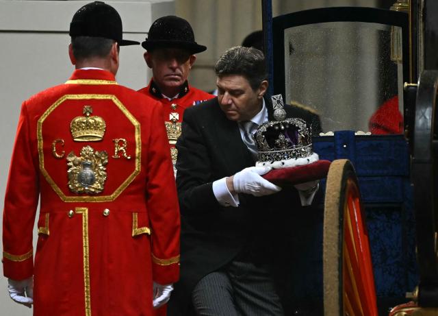 The Imperial State Crown is carried into the Houses of Parliament in London on May 13, 2026, for the State Opening of Parliament.  (Photo by JUSTIN TALLIS / POOL / AFP)