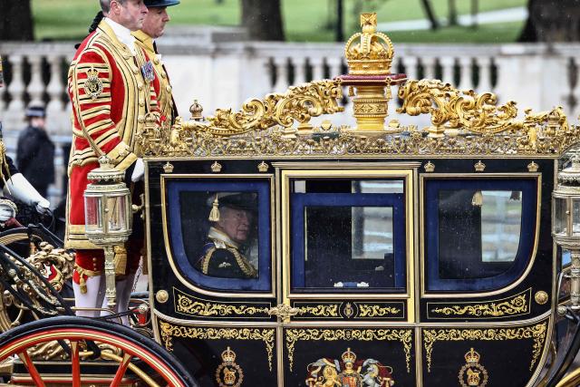 Britain's King Charles III departs Buckingham Palace to attend the State Opening of Parliament, in London on May 13, 2026. (Photo by Henry NICHOLLS / AFP)