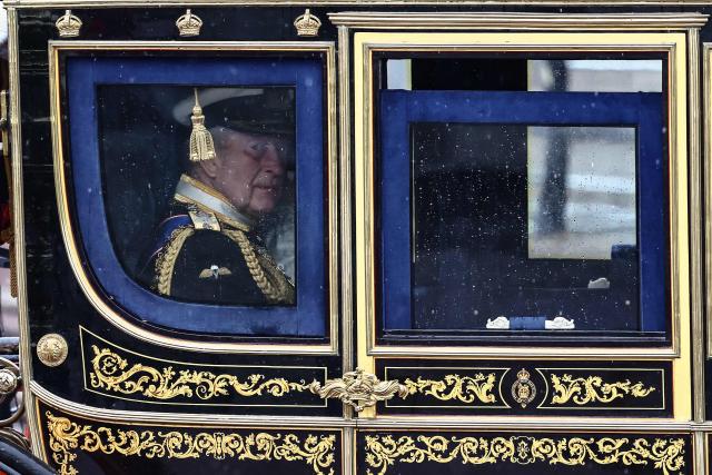 Britain's King Charles III departs Buckingham Palace to attend the State Opening of Parliament, in London on May 13, 2026. (Photo by Henry NICHOLLS / AFP)