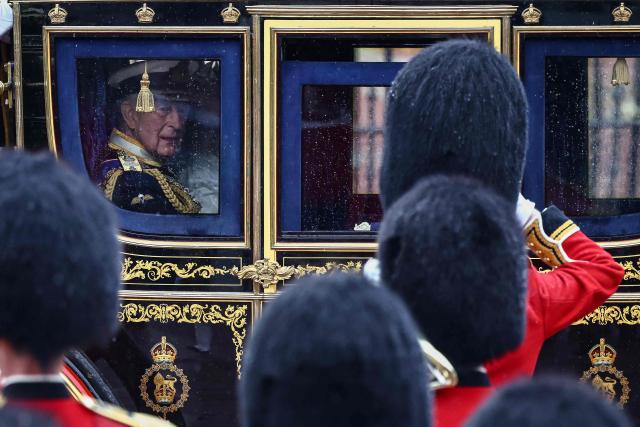 Britain's King Charles III departs Buckingham Palace to attend the State Opening of Parliament, in London on May 13, 2026. (Photo by Henry NICHOLLS / AFP)