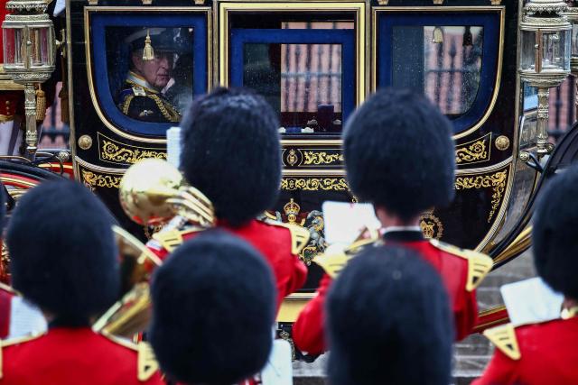 Britain's King Charles III departs Buckingham Palace to attend the State Opening of Parliament, in London on May 13, 2026. (Photo by Henry NICHOLLS / AFP)