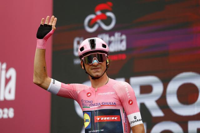 Lidl - Trek Italian rider Giulio Ciccone wearing the overall leader's pink jersey waves on the podium as he arrives ahead of the 5th stage of the Giro d'Italia 2026 - Tour of Italy cycling race between Praia a Mare and Potenza, southern Italy on May 13, 2026. (Photo by Luca Bettini / AFP)