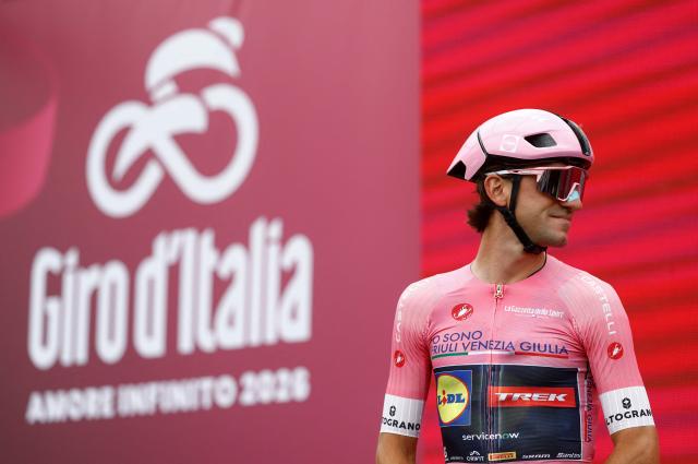 Lidl - Trek Italian rider Giulio Ciccone wearing the overall leader's pink jersey poses on the podium as he arrives ahead of the 5th stage of the Giro d'Italia 2026 - Tour of Italy cycling race between Praia a Mare and Potenza, southern Italy on May 13, 2026. (Photo by Luca Bettini / AFP)