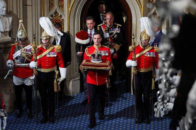 The Imperial State Crown arrives at the Sovereign's Entrance during the State Opening of Parliament at the Houses of Parliament, in London, on May 13, 2026. (Photo by Suzanne Plunkett / POOL / AFP)