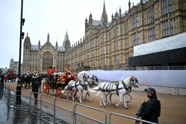 Queen Alexandra's State Coach, carrying the Imperial State Crown and the Sword of State arrives at the Houses of Parliament in London on May 13, 2026, for the State Opening of Parliament.  (Photo by JUSTIN TALLIS / POOL / AFP)