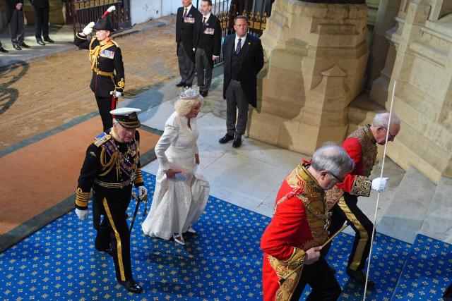 Britain's King Charles III and Britain's Queen Camilla arrive at the Sovereign's Entrance during the State Opening of Parliament at the Houses of Parliament, in London, on May 13, 2026. (Photo by Aaron Chown / POOL / AFP)