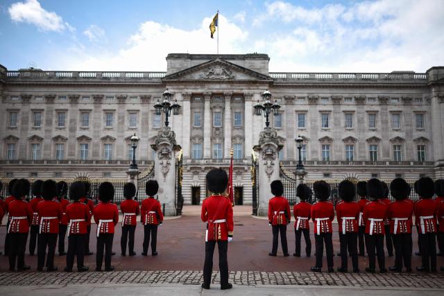 Household Division Foot Guards stand outside Buckingham Palace during the State Opening of Parliament, in London on May 13, 2026. (Photo by Henry Nicholls / AFP)