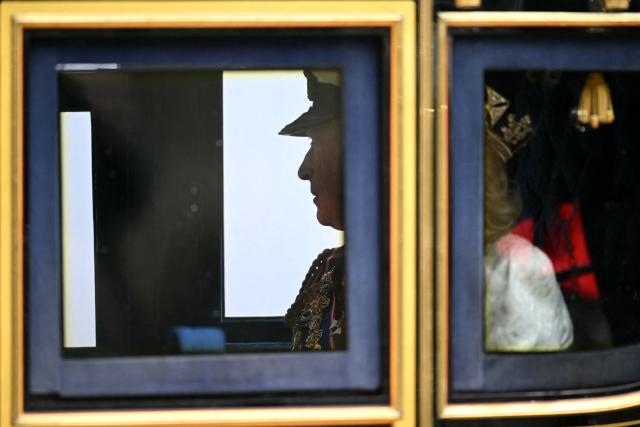 Britain's King Charles III and Britain's Queen Camilla depart the Houses of Parliament in London on May 13, 2026, following the State Opening of Parliament.  (Photo by JUSTIN TALLIS / POOL / AFP)