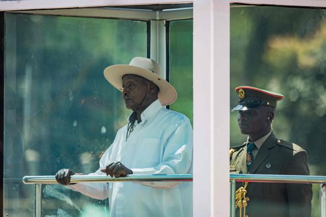 Uganda's President Yoweri Museveni (L) inspects a military parade during his inauguration ceremony as re-elected president at Kololo Ceremonial grounds in Kampala on May 12, 2026. (Photo by BADRU KATUMBA / AFP)