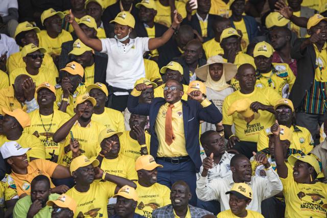 Supporters of Uganda’s President Yoweri Museveni react during the inauguration ceremony following his re-election as president at the Kololo Ceremonial Grounds in Kampala on May 12, 2026. (Photo by BADRU KATUMBA / AFP)
