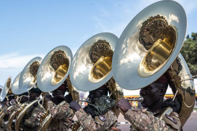 Members of the Uganda People's Defence Forces band perform during the inauguration ceremony of Uganda’s President Yoweri Museveni following his re-election as president at the Kololo Ceremonial Grounds in Kampala on May 12, 2026. (Photo by BADRU KATUMBA / AFP)