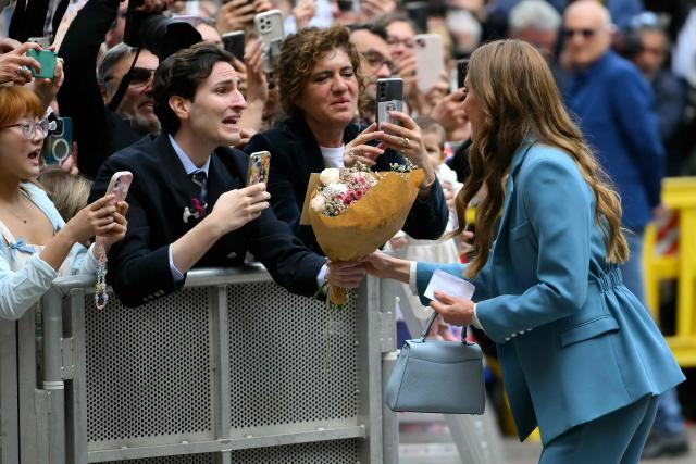 Britain's Catherine, Princess of Wales greets people outside Reggio Emilia's town hall as part of a two-day visit in Italy, on May 13, 2026. (Photo by Marco BERTORELLO / POOL / AFP)