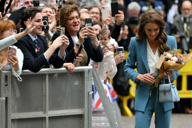 Britain's Catherine, Princess of Wales greets people outside Reggio Emilia's town hall as part of a two-day visit in Italy, on May 13, 2026. (Photo by Marco BERTORELLO / POOL / AFP)