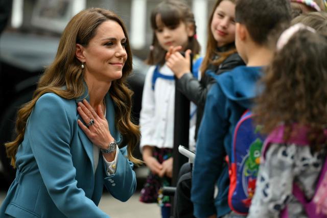 Britain's Catherine, Princess of Wales meets with children outside Reggio Emilia's town hall as part of a two-day visit in Italy, on May 13, 2026. (Photo by Marco BERTORELLO / POOL / AFP)