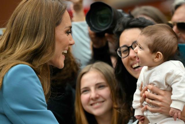 TOPSHOT - Britain's Catherine, Princess of Wales greets people outside Reggio Emilia's town hall as part of a two-day visit in Italy, on May 13, 2026. (Photo by Marco BERTORELLO / POOL / AFP)