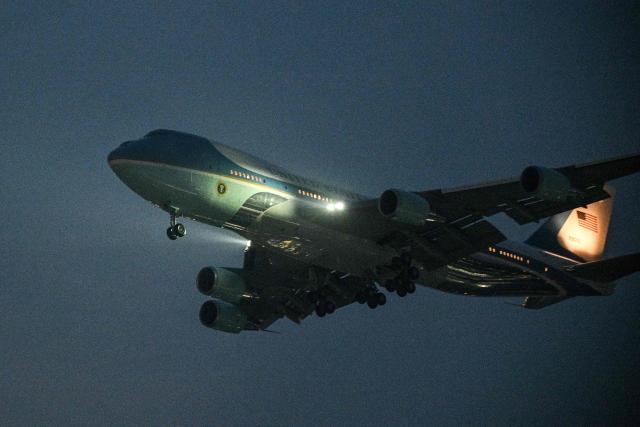 Air Force One, carrying US President Donald Trump, arrives at Beijing Capital Airport in Beijing on May 13, 2026. (Photo by Hector RETAMAL / AFP)