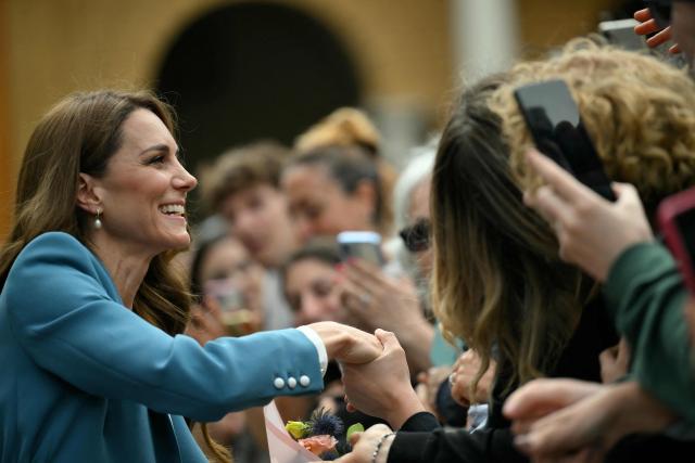 Britain's Catherine, Princess of Wales greets people outside Reggio Emilia's town hall as part of a two-day visit in Italy, on May 13, 2026. (Photo by Marco BERTORELLO / POOL / AFP)